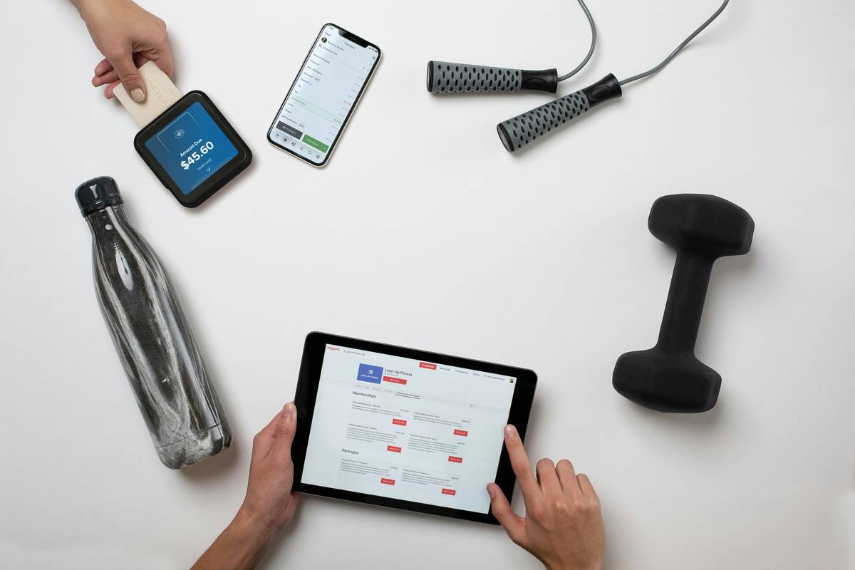 chatgpt prompt for workout plan showing person reviewing AI-generated routine on laptop at gym